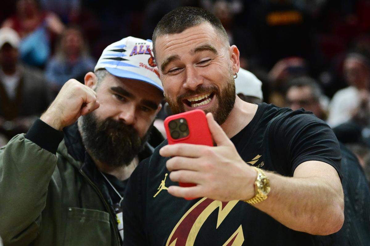 Cleveland natives Travis, right, and Jason Kelce celebrate after the Cleveland Cavaliers beat the Boston Celtics during the second half at Rocket Mortgage Fieldhouse on March 5, 2024.