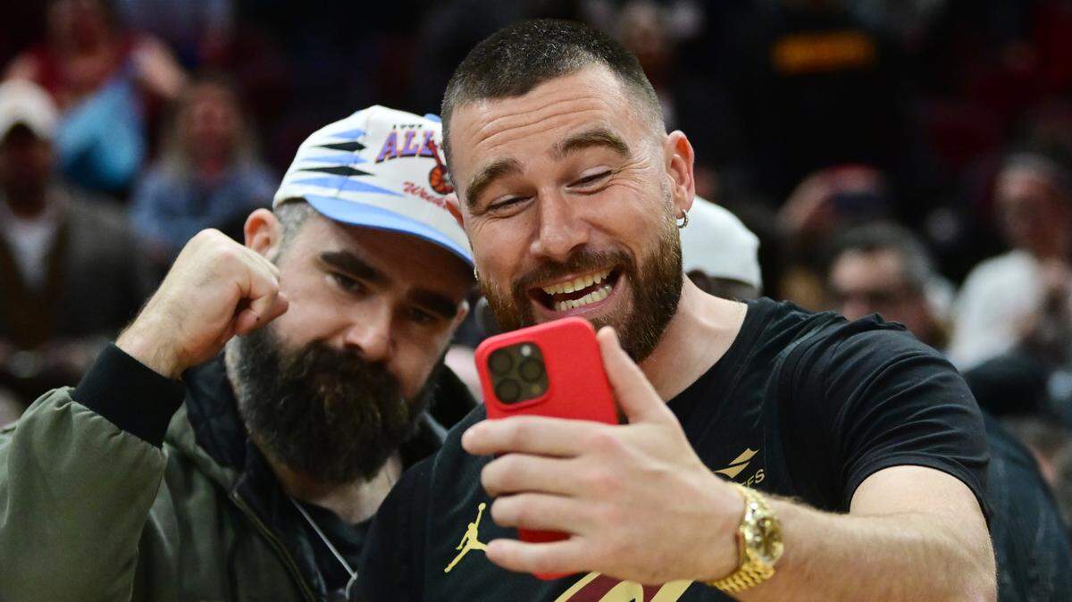 Cleveland natives Travis, right, and Jason Kelce celebrate after the Cleveland Cavaliers beat the Boston Celtics during the second half at Rocket Mortgage Fieldhouse on March 5, 2024.