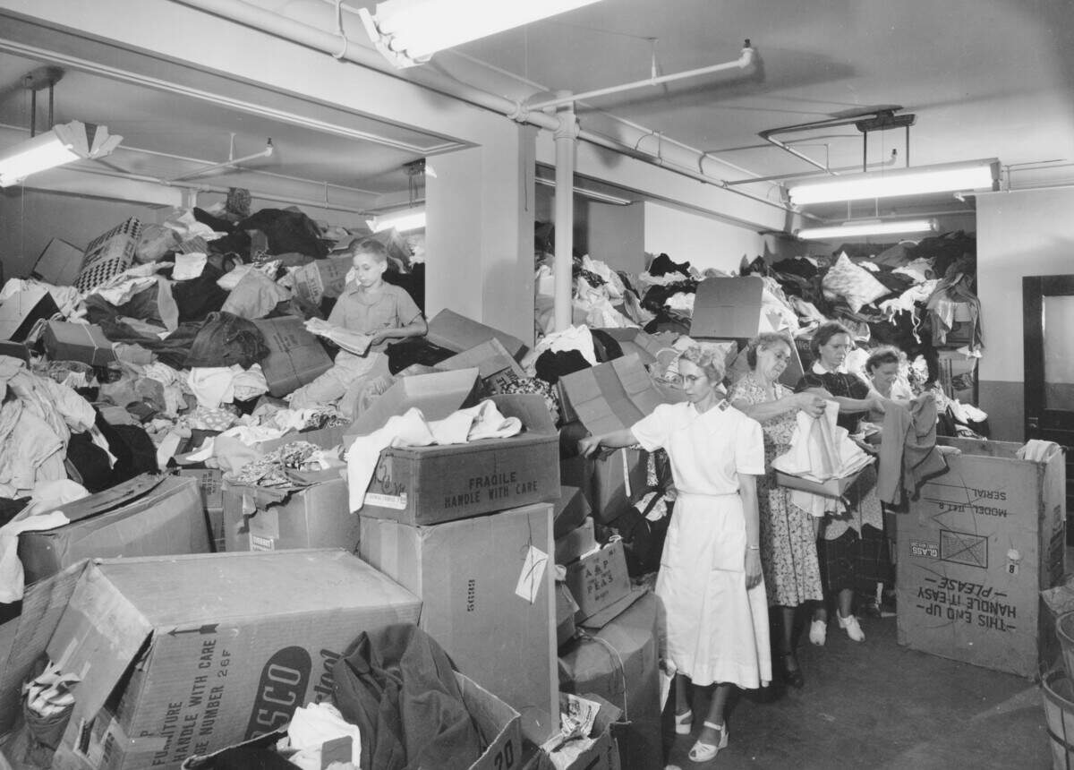 Salvation Army workers sort through clothing donated during the 1951 Flood.