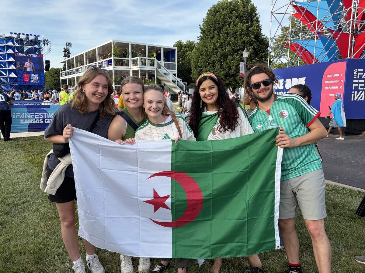 Imene Tabot (middle right) is from Algiers, Algeria, but currently lives in St. Louis. She traveled with her partner (right) to meet up with her friends to watch Algeria take on Argentina at Fan Fest Tuesday, June 16.