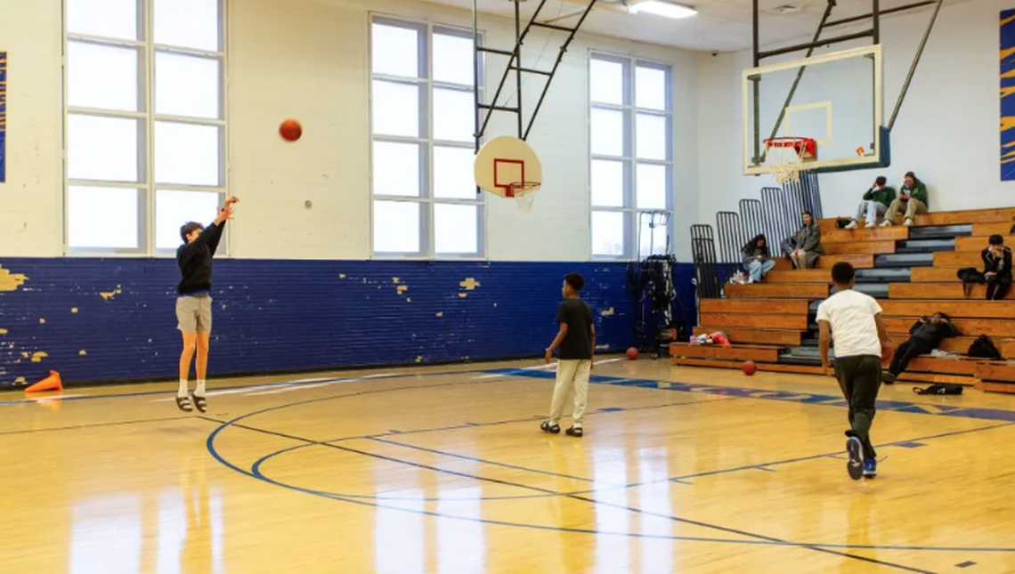 Students play basketball during gym class at Lincoln College Preparatory Academy. Because of the building layout, the school can’t host home games in the gym.