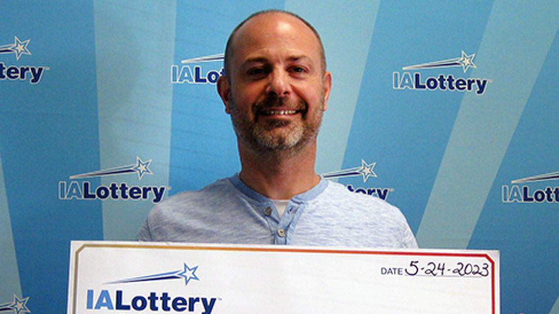 Shawn Holub with his oversized check.