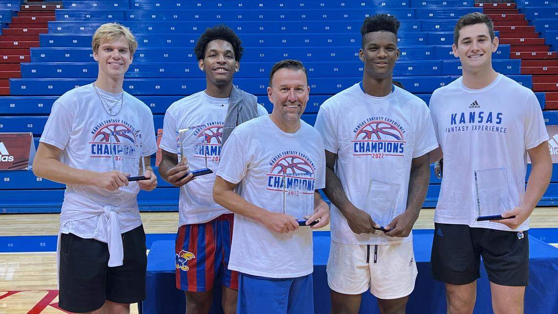 KU basketball players Gradey Dick, MJ Rice, KJ Adams and Dillon Wilhite pose for pictures with a fantasy camper after Adams’ Blue team won the Kansas Fantasy Experience title game Sunday at Allen Fieldhouse. Adams was head coach, the other Jayhawks assistants at the NIL event.