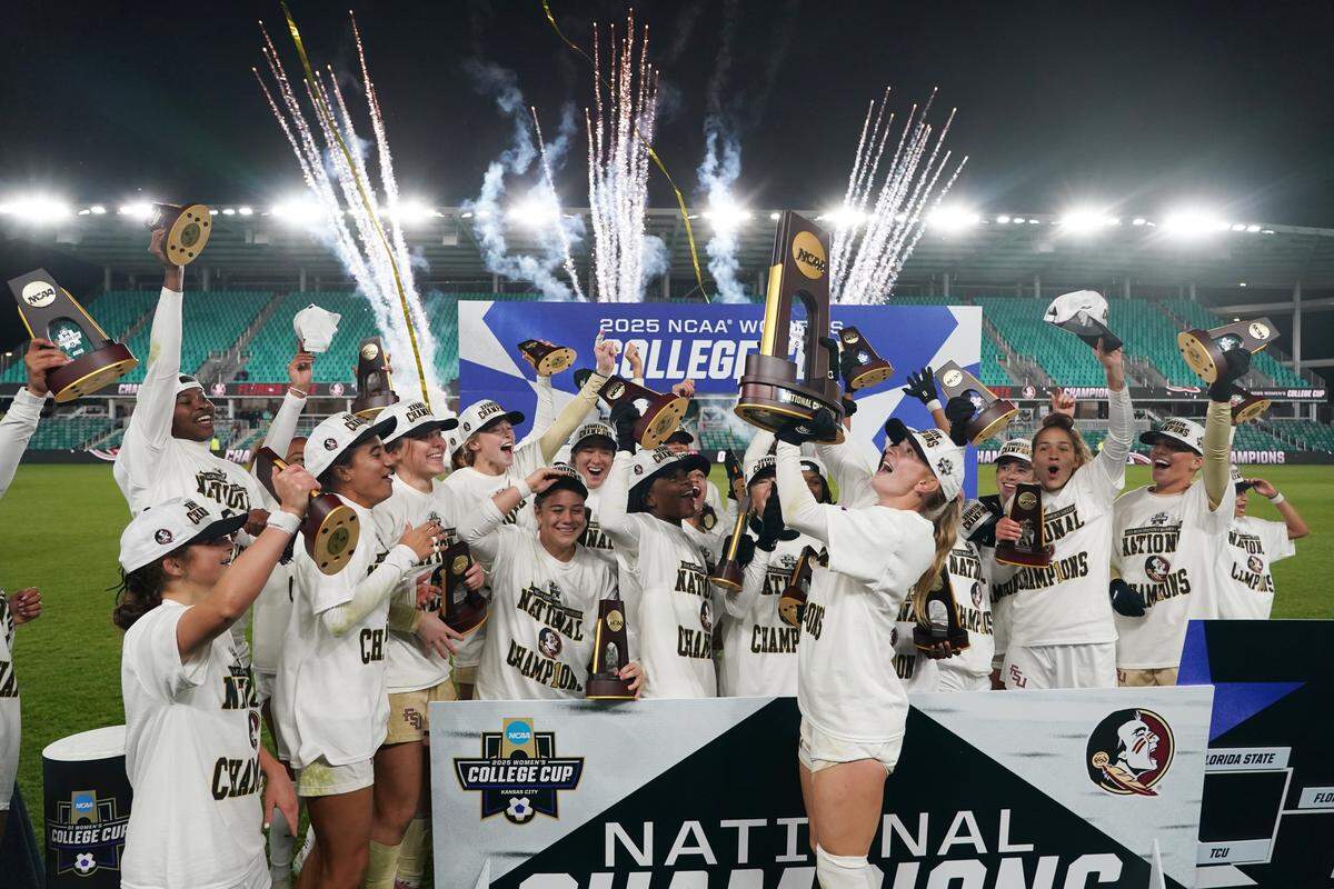Florida State Seminoles players celebrate after winning the NCAA Division I Women's Soccer Championship against the Stanford Cardinal at CPKC Stadium on December 8, 2025 in Kansas City.