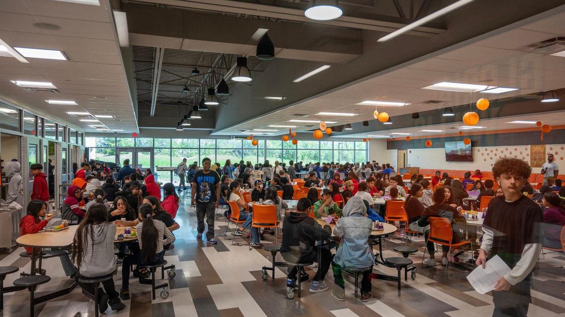 Students are seen dining in the cafeteria at Gloria Willis Middle School on Tuesday, April 16, 2024, in Kansas City, Kansas.