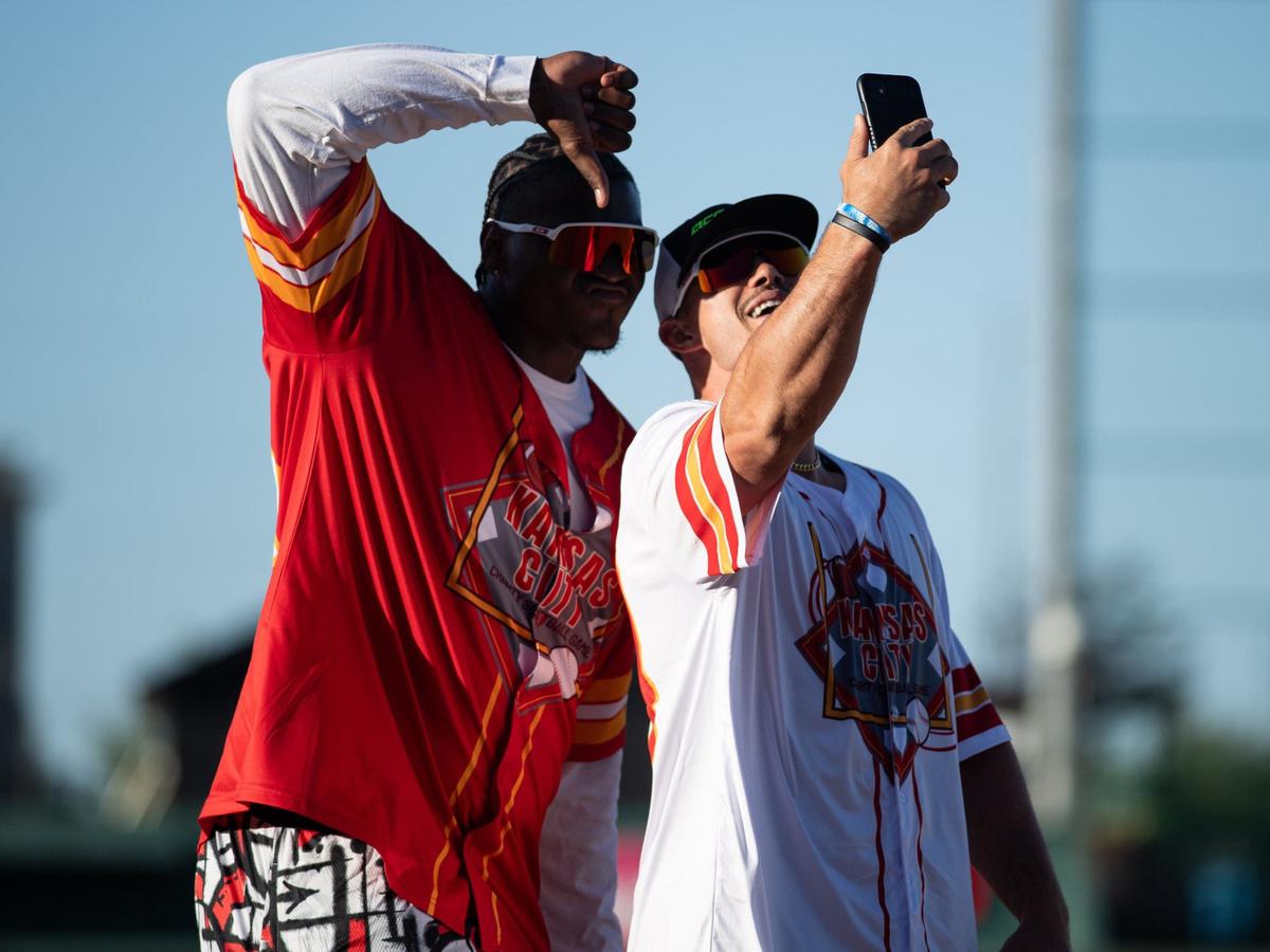 Kansas City Chiefs linebacker Drue Tranquill (right) celebrates a home run during the Kansas City Charity Softball Game on Thursday, June 6, 2024, at Legends Field in Kansas City, Kansas.