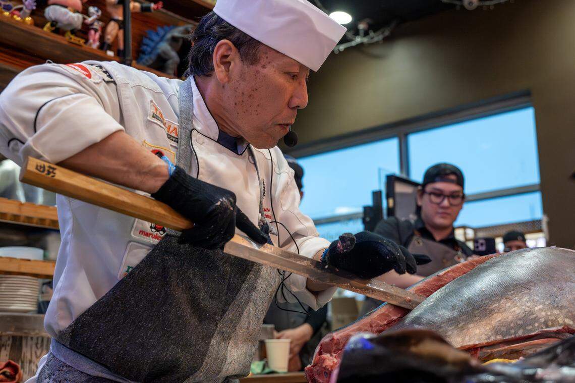 Chef Andy F. Matsuda slices into a bluefin tuna during a cutting show at KC Craft Ramen on Monday, March 2, 2026, in Overland Park.