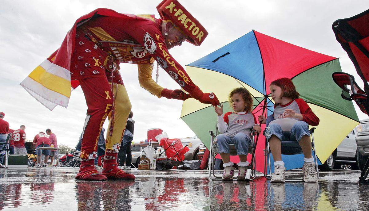 Young tailgaters got a visit from X-Factor, also known as Ty Rowton of Shawnee, in the Arrowhead Stadium parking lot before the Kansas City Chiefs game against the St. Louis Rams in 2004. 