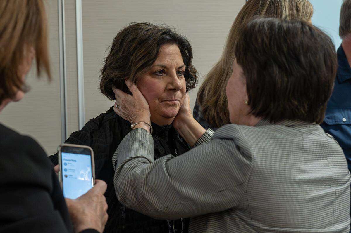 Rose Mulvany Henry, a candidate for mayor and CEO of the Unified Government of Wyandotte County and Kansas City, Kan., is embraced by a supporter after conceding to Christal Watson during her watch party at Margaritaville on Tuesday, Nov. 4, 2025, in Kansas City, Kan.