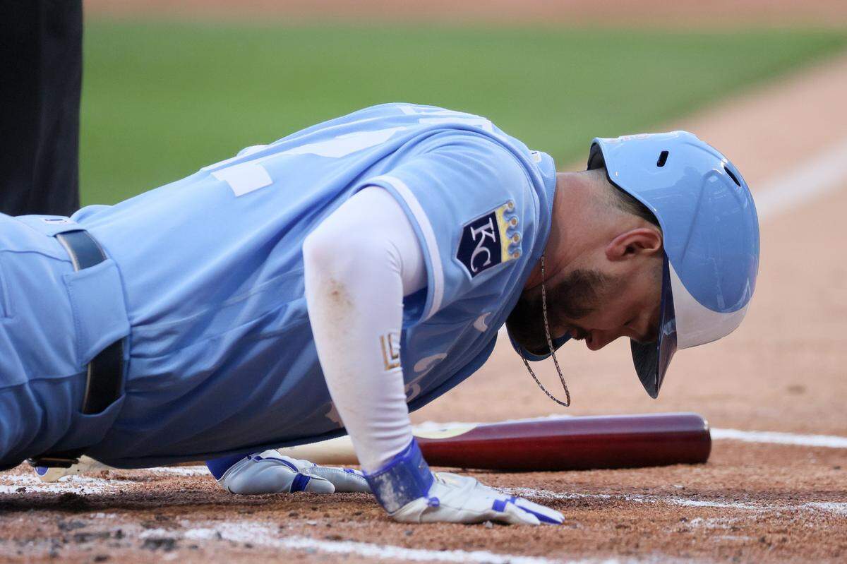 Kansas City Royals second baseman Nick Loftin falls to the ground after being hit by a pitch during the first inning of a Thursday, May 14, 2026 MLB game against the White Sox at Rate Field in Chicago.