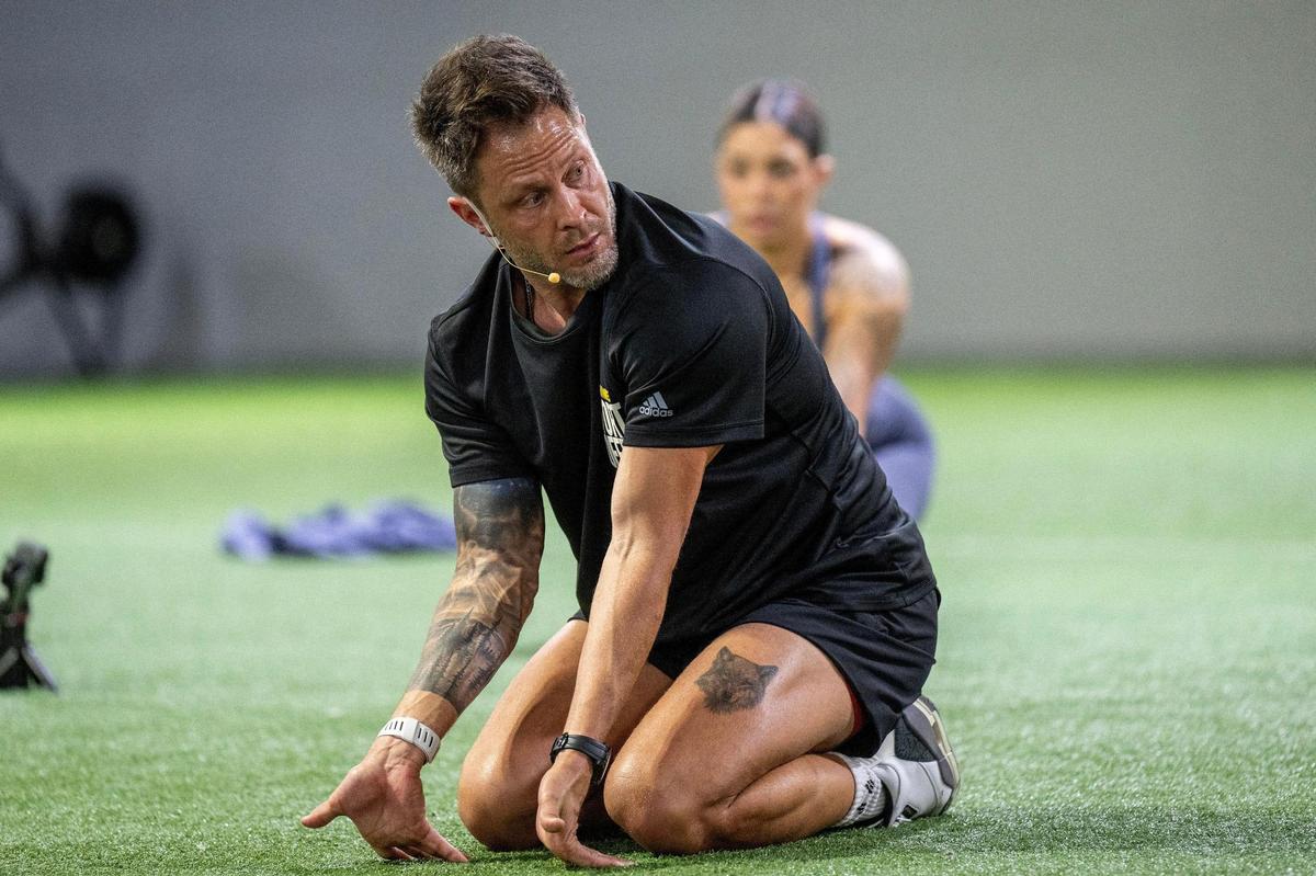 Stroupe showed a technique for stretching arms and wrists during his workout demonstration in Olathe.