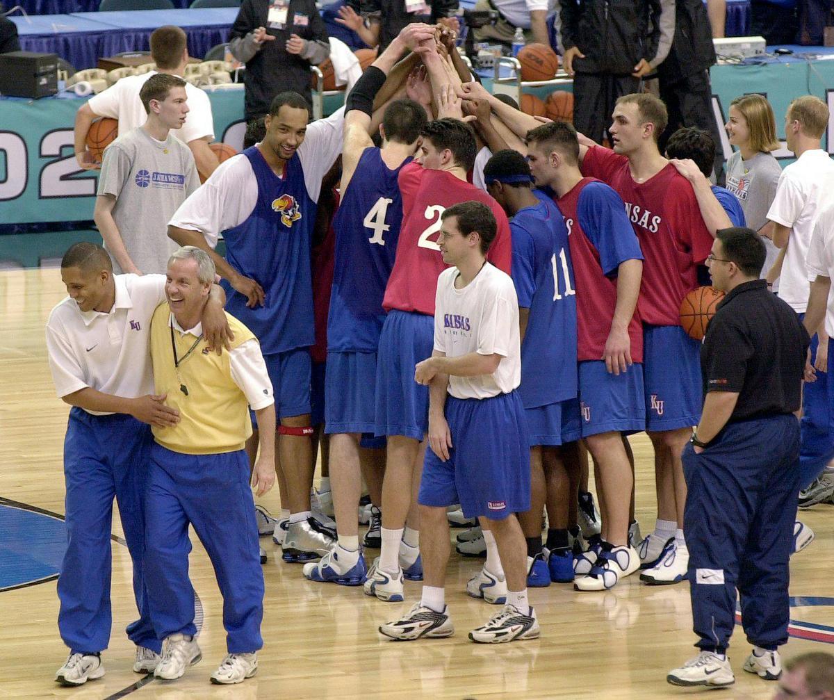 University of Kansas head coach Roy Williams and assistant coach Neil Dougherty walk off the court sharing a laugh at the end of a practice at the 2002 Final Four practice in Atlanta, GA.
