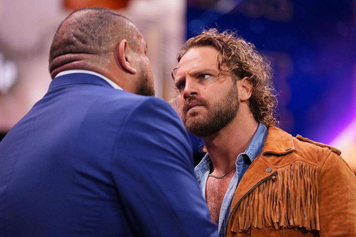 AEW world champion “Hangman” Adam Page confronts AEW WrestleDream opponent Samoa Joe ahead of their title match at the Daily’s Place in Jacksonville, Florida on Oct. 7, 2025.