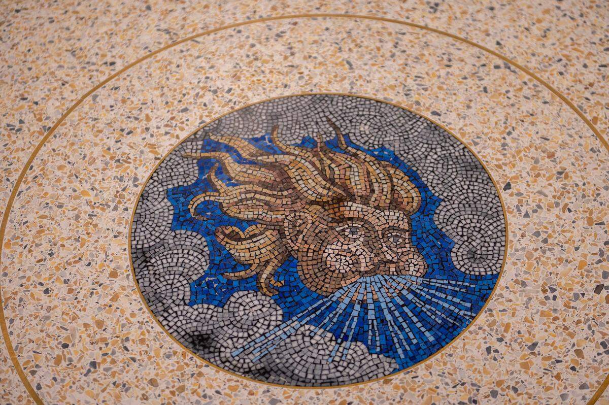A mosaic is displayed on floor at Kansas City International Airport on Tuesday, Feb. 14, 2023. The mosaic was harvested from parts of the old terminal floor at Kansas City International Airport.
