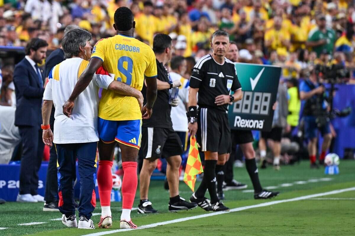 Colombia forward Jhon Córdoba (9) is assisted in walking off the pitch in the first half of the Colombia vs. Ghana 2026 World Cup round of 32 football match at Kansas City (Arrowhead) Stadium in Kansas City on Friday, July 3, 2026.