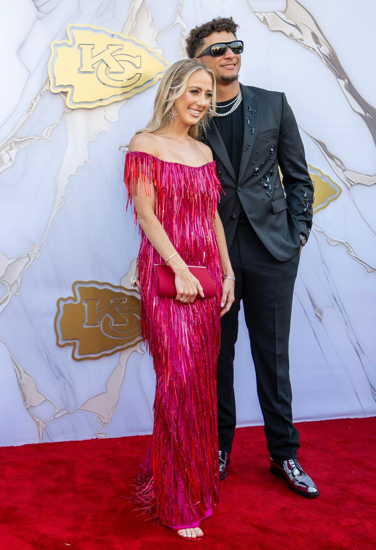 Chiefs quarterback Patrick Mahomes and his wife, Brittany Mahomes posed on the red carpet before the Super Bowl LVIII championship ring presentation event.