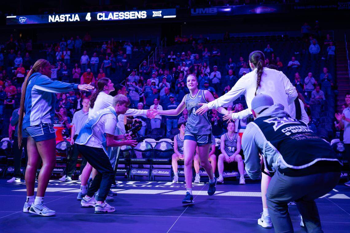 Kansas State Wildcats forward Nastja Claessens (4) runs onto the court after being introduced as a starter against Oklahoma State during the Big 12 Women’s Basketball Tournament at the T-Mobile Center on Friday, March 6, 2026, in Kansas City, Missouri.