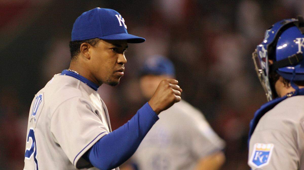 Kansas City Royals pitcher Octavio Dotel (29) and catcher Jason LaRue (6) celebrate after the Royals win 5-3 against the Los Angeles Angels at Angel Stadium in Anaheim in 2007.