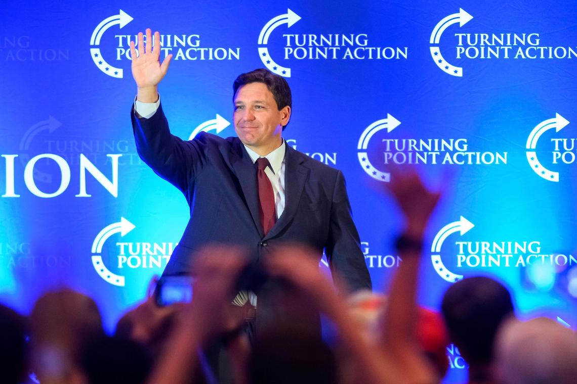 Florida Gov. Ron DeSantis waved to the crowd as he left the stage after his speech at the Turning Point Action rally Sunday at the Olathe Conference Center, Embassy Suites.
