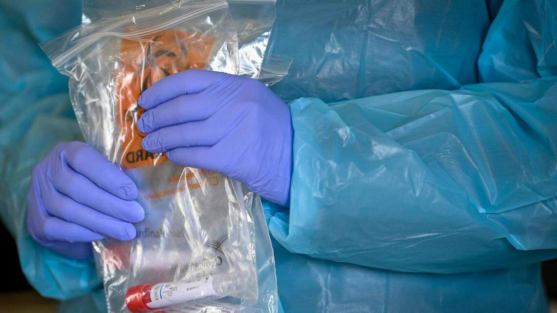 COVID-19 test swabs were bagged and prepared for testing during a drive-thru COVID-19 clinic Wednesday, January 5, 2022, at 616 N.E. Douglas St., in Lee’s Summit.