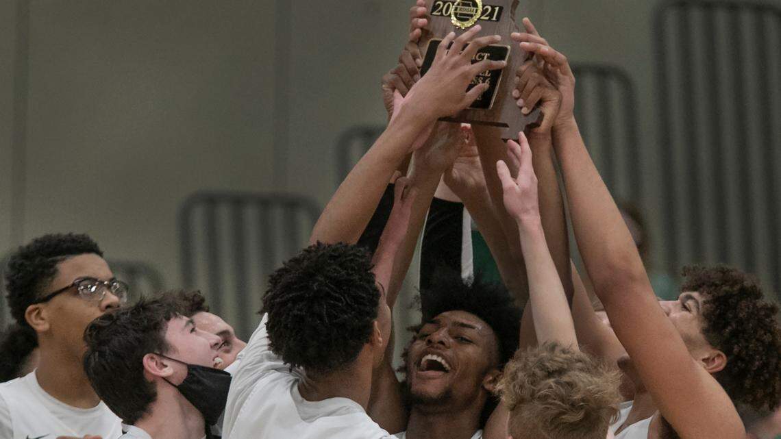Kyan Evans (center) and the Staley Falcons, celebrated their 49-42 win over The Park Hill South Panthers at the class 6 district 16 basketball tournament championship Friday, March 5, 2021 at Staley.