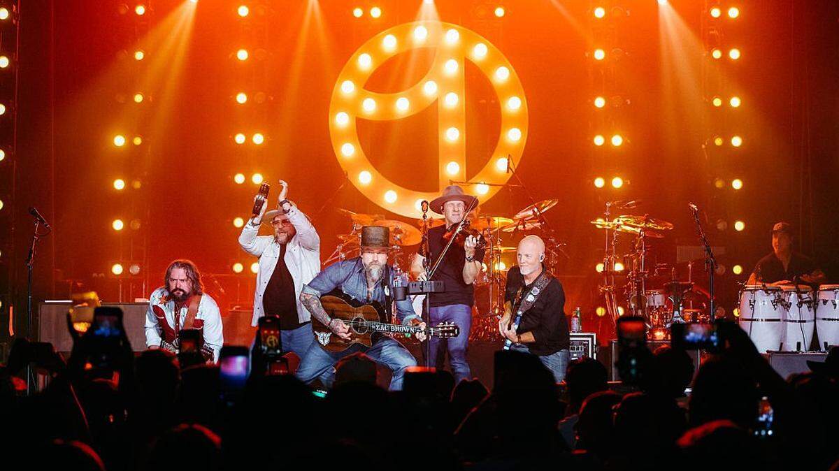 AUSTIN, TEXAS - OCTOBER 18: Zac Brown Band perform onstage during the Uber One Rodeo on October 18, 2025 in Austin, Texas. (Photo by Rick Kern/Getty Images for Uber)