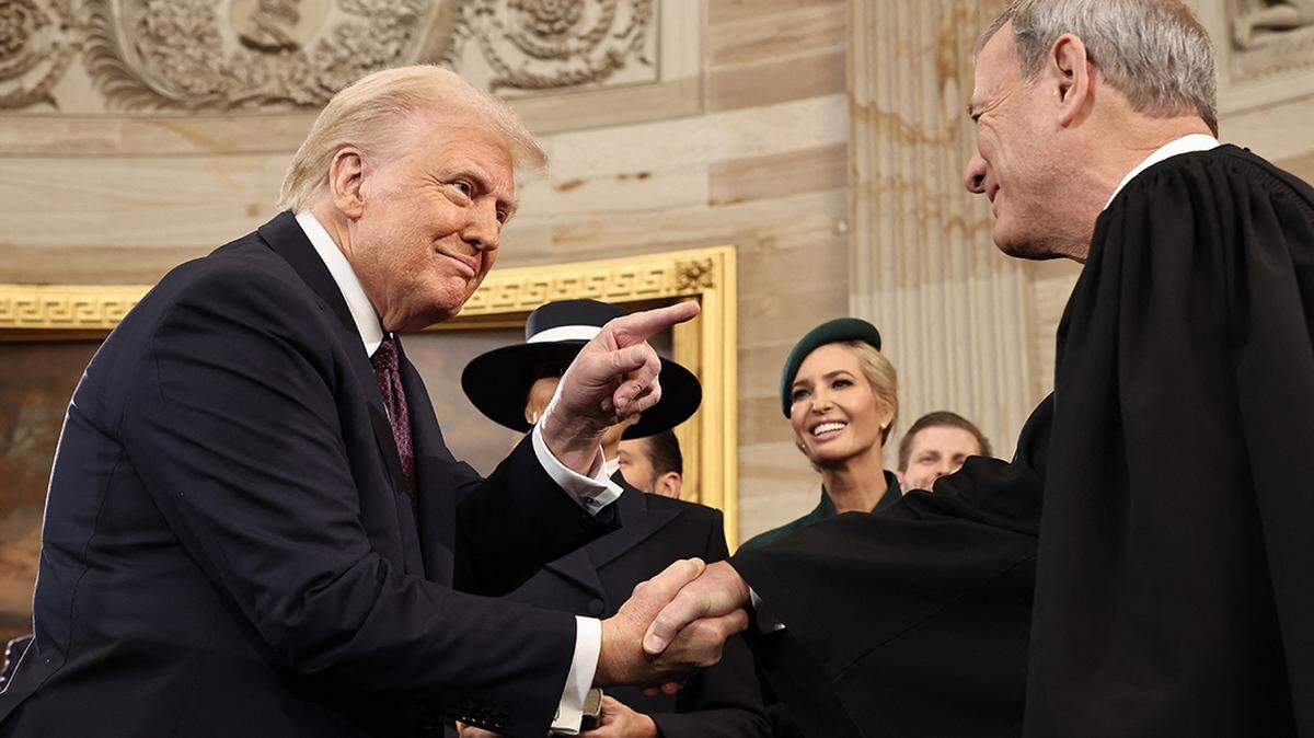 TOPSHOT - US President Donald Trump shakes hands with US Supreme Court Chief Justice John Roberts after he was sworn in during inauguration ceremonies in the Rotunda of the US Capitol on January 20, 2025 in Washington, DC. Donald Trump takes office for his second term as the 47th president of the United States. (Photo by Chip Somodevilla / POOL / AFP) (Photo by CHIP SOMODEVILLA/POOL/AFP via Getty Images)