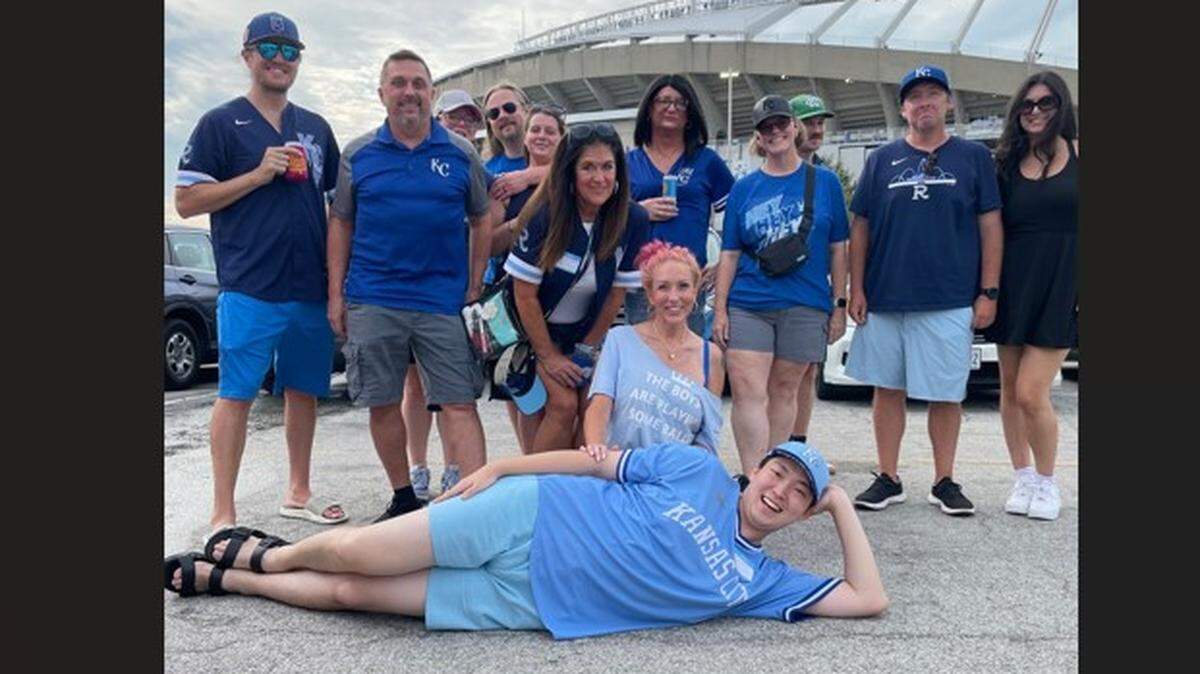 Jun Hong Kim with his friends at Kauffman Stadium on Friday night.