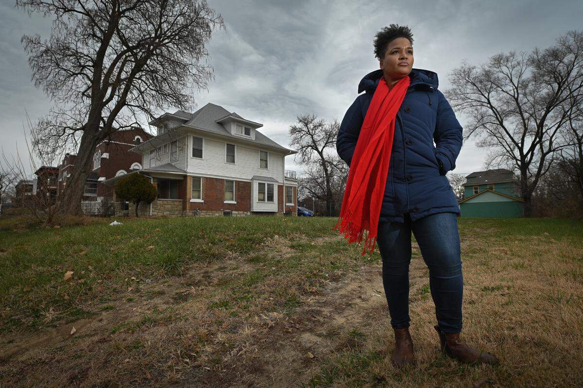 Monica Henderson stands in the vacant lot that she would like to buy from the Land Bank, but has been denied. The lot is adjacent to a home she recently purchased in the 2600 block of Benton Boulevard. The home is in the process of being renovated and Henderson hopes to live there with her two children beginning next spring.