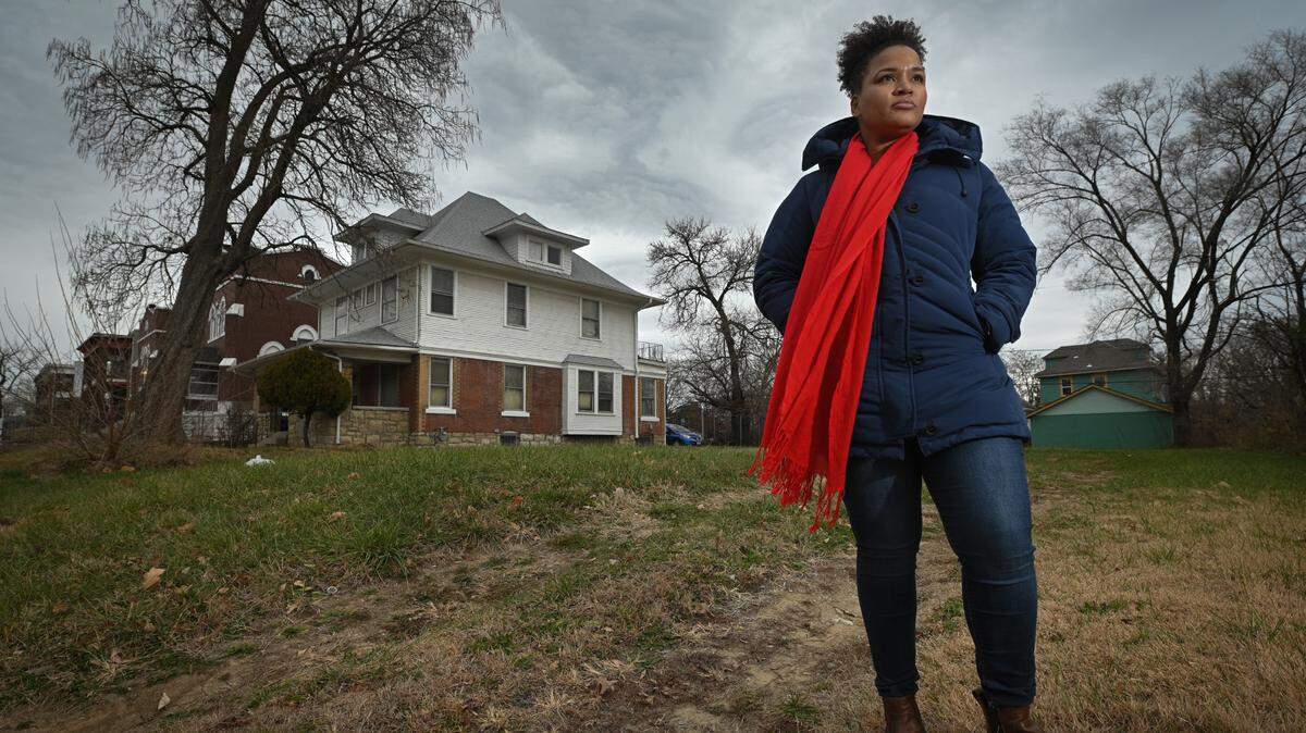 Monica Henderson stands in the vacant lot that she would like to buy from the Land Bank, but has been denied. The lot is adjacent to a home she recently purchased in the 2600 block of Benton Boulevard. The home is in the process of being renovated and Henderson hopes to live there with her two children beginning next spring.