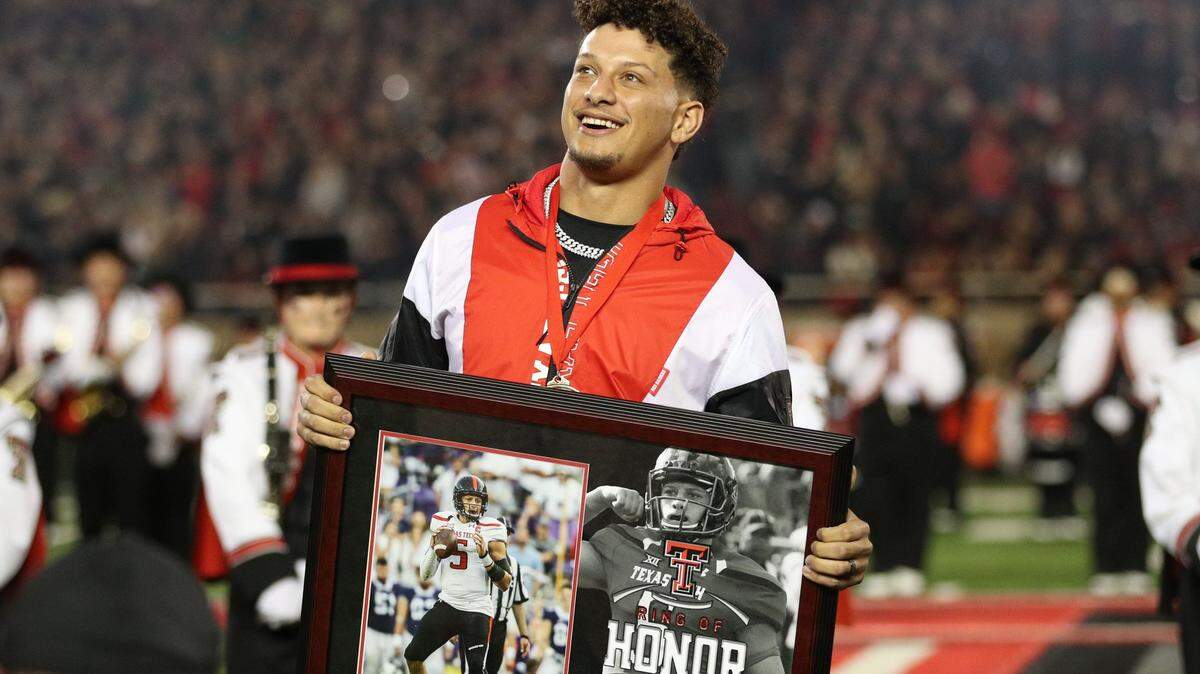 Kansas City Chiefs quarterback Patrick Mahomes watches as his name is unveiled during his induction in the Ring of Honor at half-time of a game between the Texas Tech Red Raiders and the Baylor Bears at Jones AT&T Stadium and Cody Campbell Field.