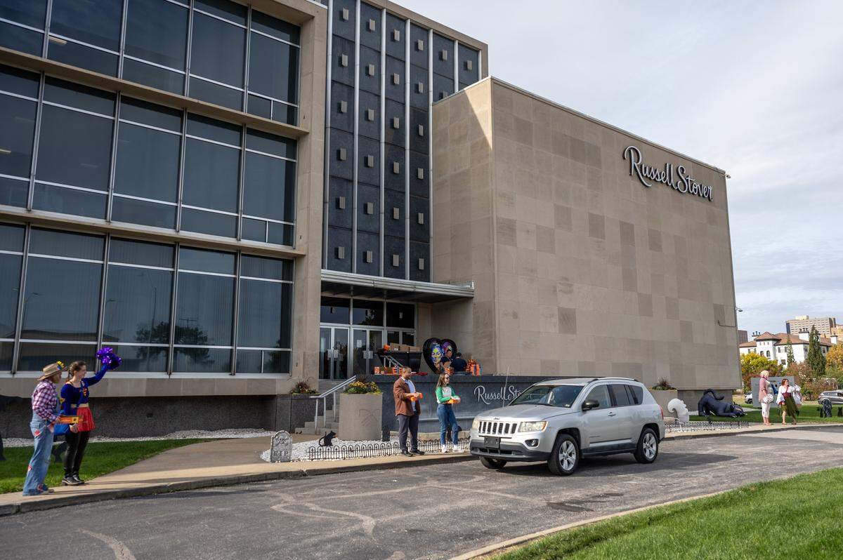A visitor drives up to Russell Stover's headquarters to receive candy during the company's annual Halloween giveaway on Friday, Oct. 31, 2025, in Kansas City.