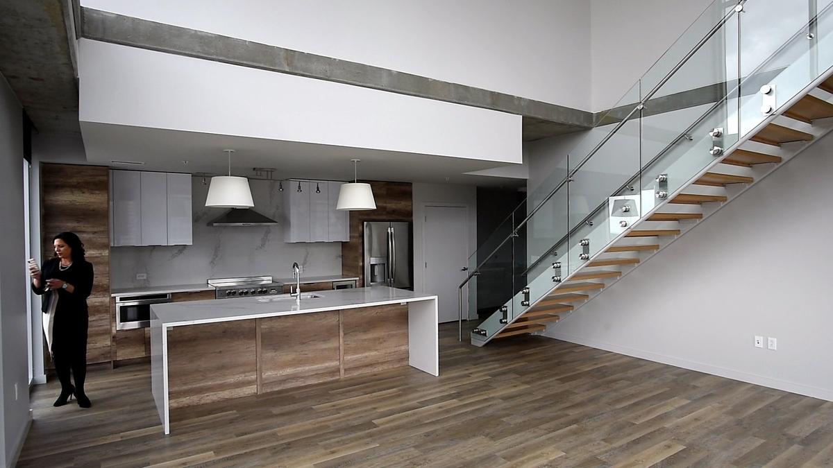 Two Light's most expensive penthouse costs $6,000 a month. The two-bedroom apartment features a private terrace with stunning city views, a master suite with walk-in closet and marble tile shower, and an upgraded kitchen with an oversized island and wine fridge.