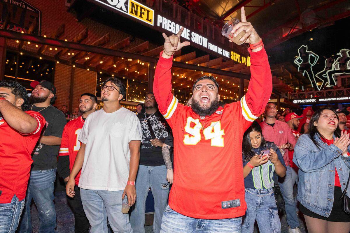 Fans scream in excitement after a touchdown in the Chiefs season opening game vs. the Los Angeles Chargers, at the KC Live! watch party on Friday, Sept. 5.