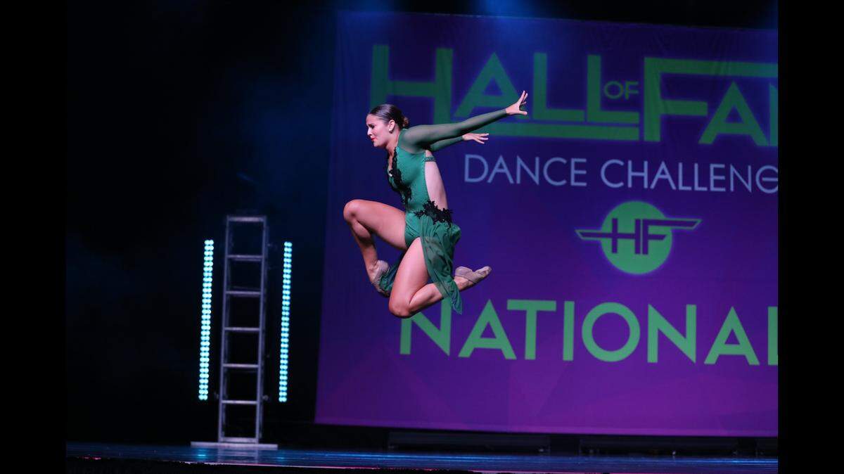 Sherry Kuehl strolled into the Overland Park Convention Center, where there was a dance competition. She recalled her days as a dance mom to her daughter, Bella, pictured.