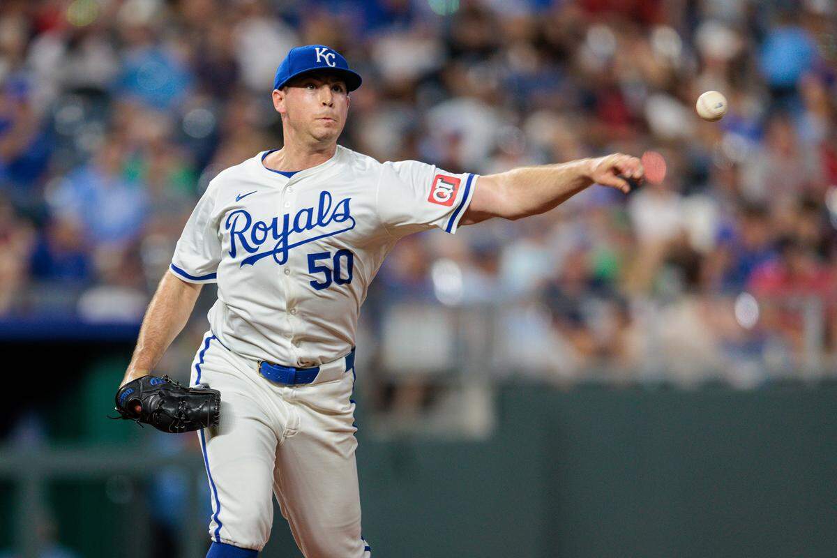 Kansas City Royals pitcher Kris Bubic (50) throws to first base during the eighth inning against the Boston Red Sox at Kauffman Stadium on Aug. 6, 2024.