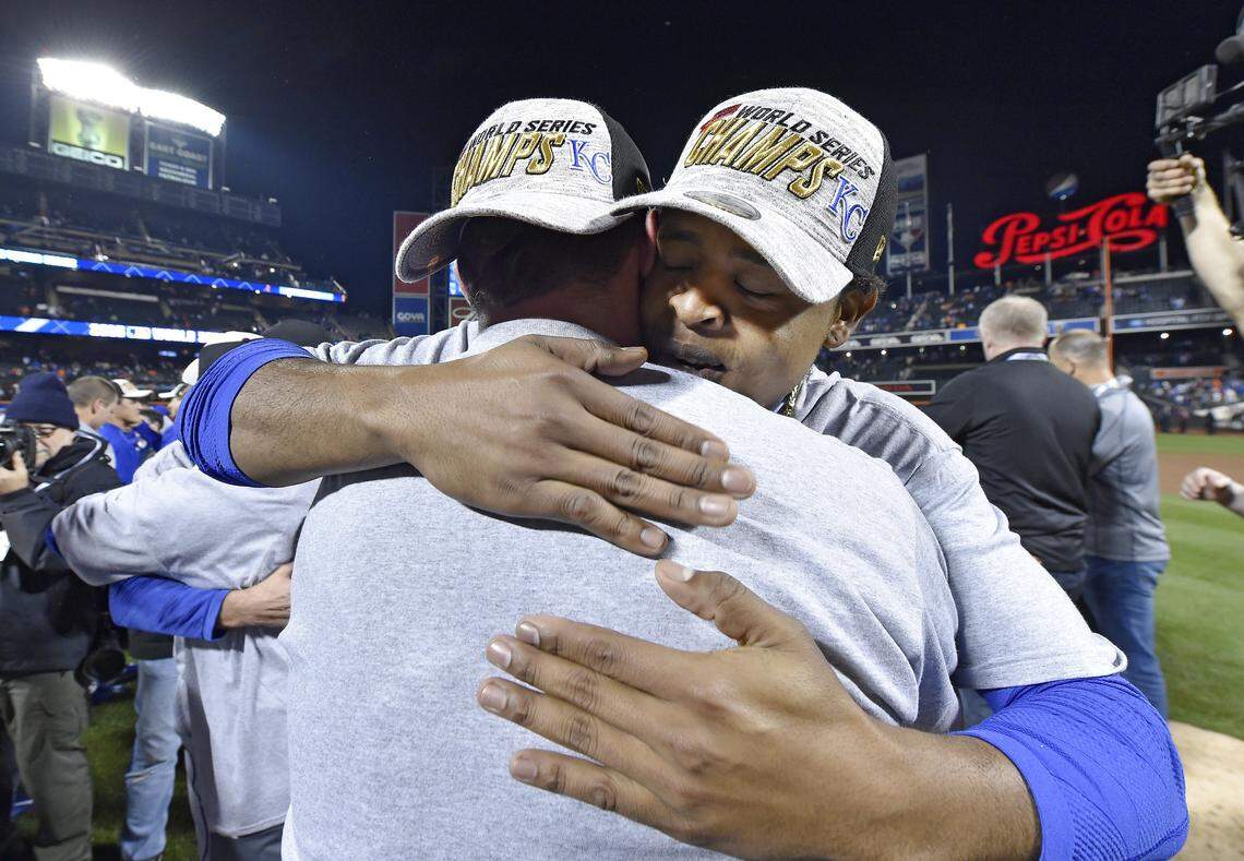 Kansas City Royals starting pitcher Edinson Volquez, right, gets a hug from a teammate after the Royals defeated the New York Mets 7-2 to win the World Series on Sunday, November 1, 2015 at Citi Field in New York.