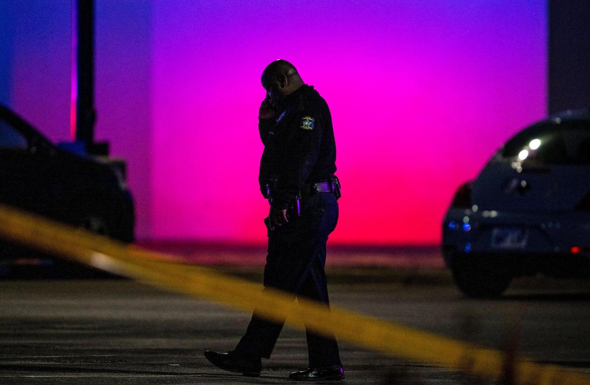 Oak Park police public information officer John Lacy talks on the phone outside of the Oak Park Mall on Sunday, Nov. 12, 2023, in Overland Park, Kan. A shoplifting suspect fired a gunshot inside the mall as two police detectives fought to detain the suspect. Nobody was injured.