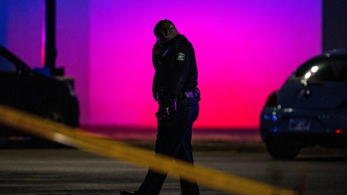Oak Park police public information officer John Lacy talks on the phone outside of the Oak Park Mall on Sunday, Nov. 12, 2023, in Overland Park, Kan. A shoplifting suspect fired a gunshot inside the mall as two police detectives fought to detain the suspect. Nobody was injured.