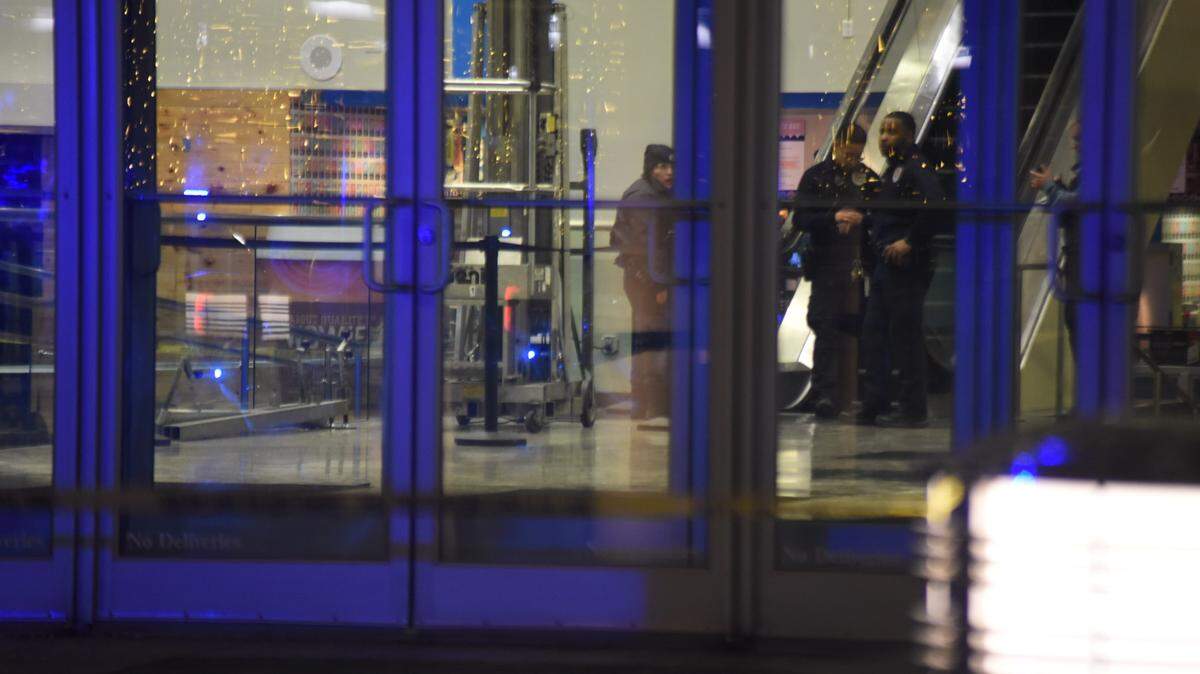 Kansas City Police officers can be seen inside the food court of the Crown Center Wednesday evening, after a shooting around 5:45 p.m. left three people injured and closed the Crown Center to visitors as police investigate.