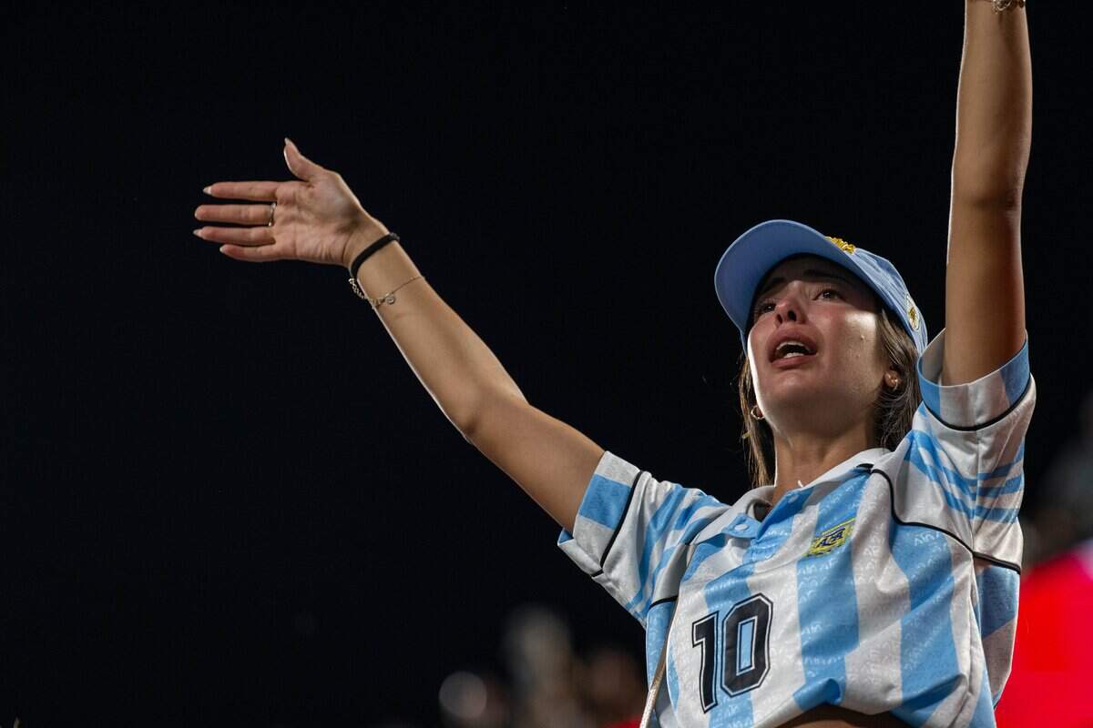 A teary eyed fan sings after Argentina wins in a 2026 FIFA World Cup quarterfinal match at Kansas City (Arrowhead) Stadium in Kansas City on Saturday, July 11, 2026.a