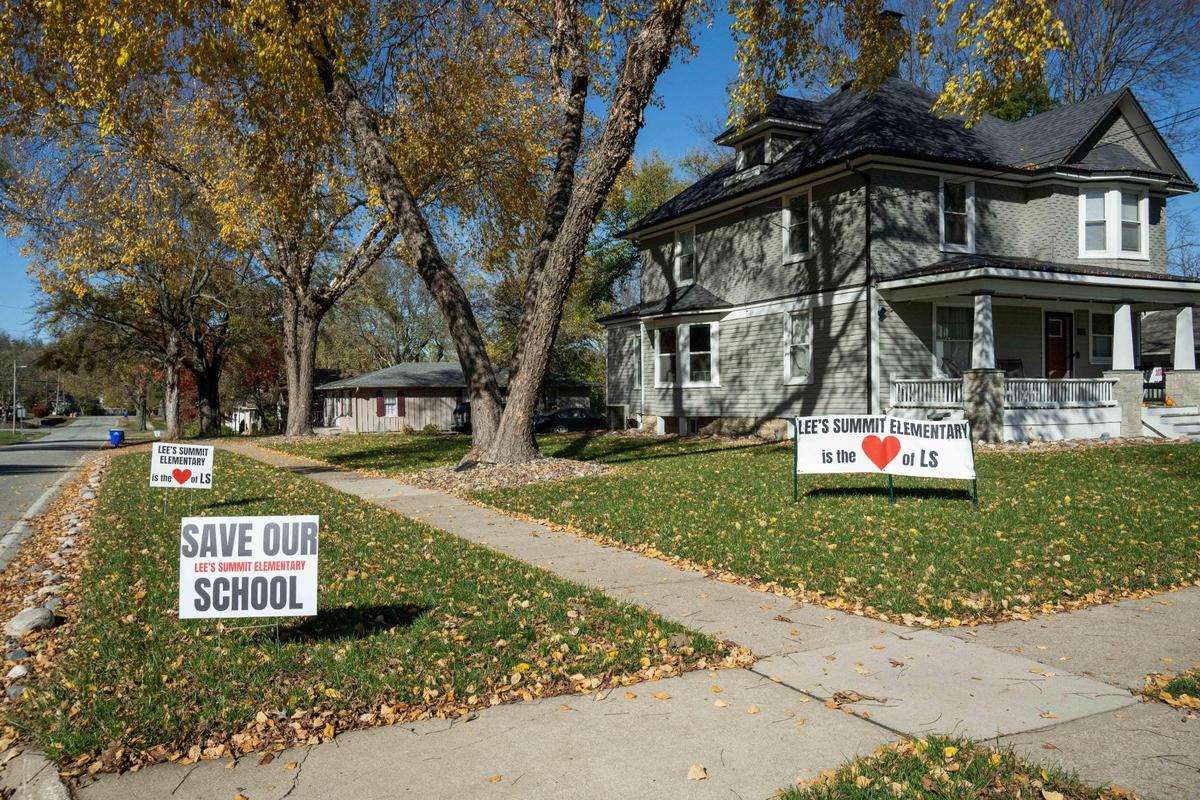 A yard displays signs in support of keeping Lee’s Summit Elementary School separate, Friday, Nov. 15, 2024. The school is being considered for consolidation.