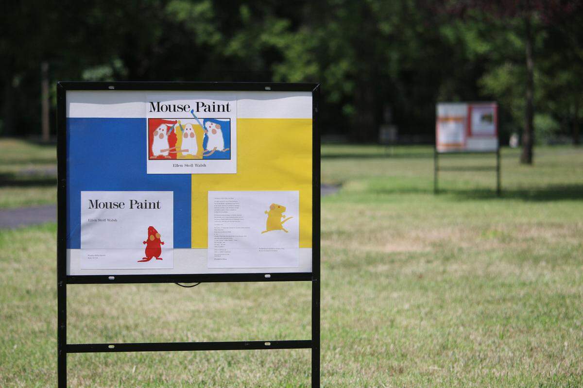The Johnson County Library put signs along the trail at Quail Creek Park in Merriam featuring the book “Mouse Paint” as part of its Walk and Read program.