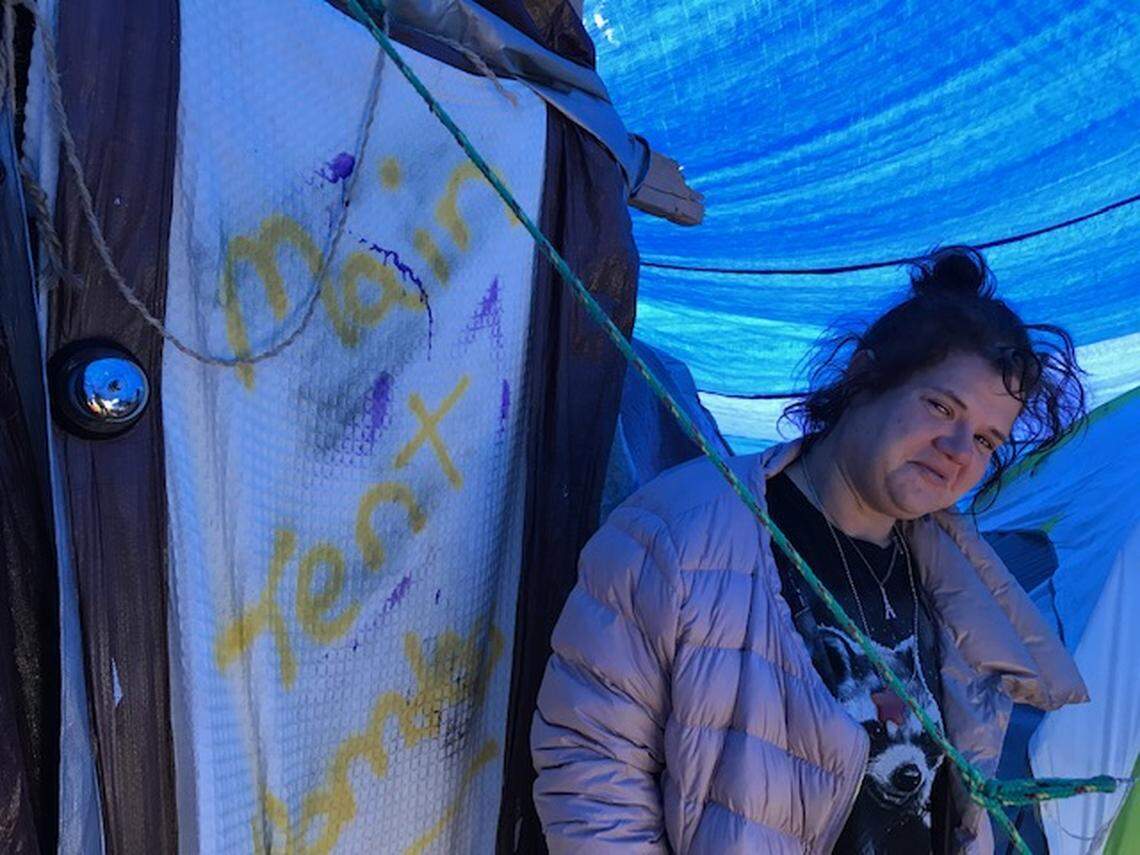 Ashlea Gray, 33, helps run the homeless encampment in Westport. A silver hotel service bell acts as a doorbell. “It’s like a hotel for the homeless,” she said, “but it’s free.”