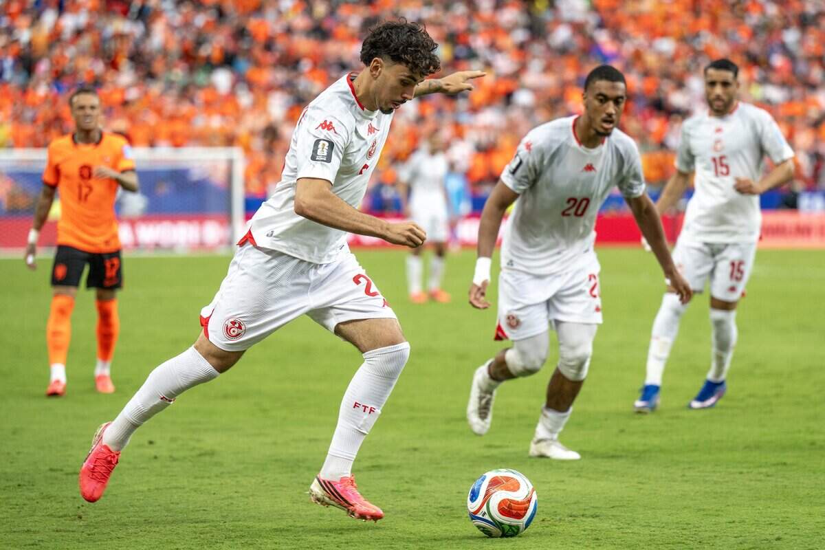 Tunisia forward Sebastian Tounekti (26) passes the ball during the second half of a FIFA World Cup group-stage soccer match against Tunisia at Kansas City Stadium on Thursday, June 25, 2026.