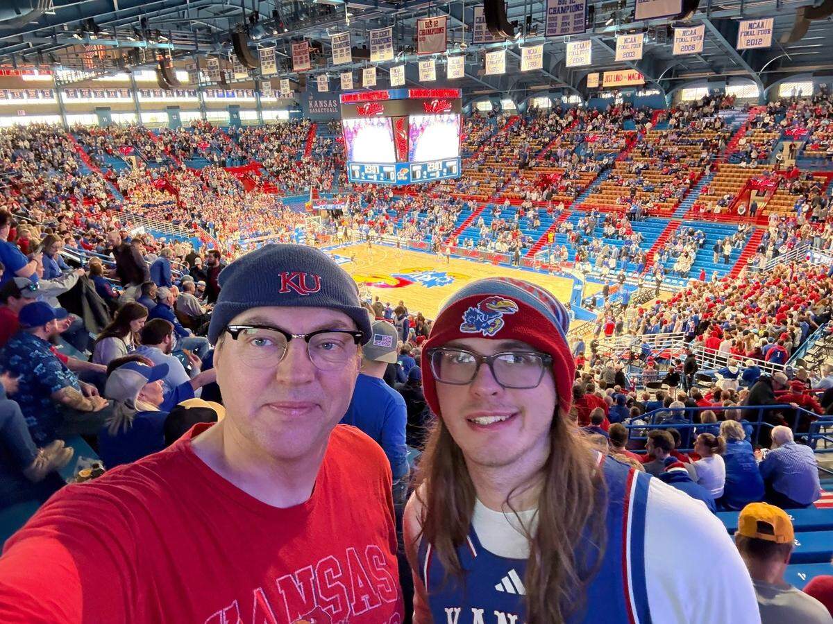Steve Pulis and his son Colin watched the Jayhawks’ Saturday victory inside balmy Allen Fieldhouse before bundling up to see the Chiefs game on Jan. 18.