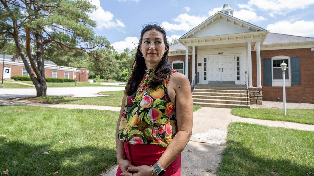 Jaclyn Penn stands for a portrait outside the old Leawood City Hall building on Wednesday, July 23, 2025, in Leawood, Kansas. Penn is among a group of residents pushing to convert the vacant structure into a community center.