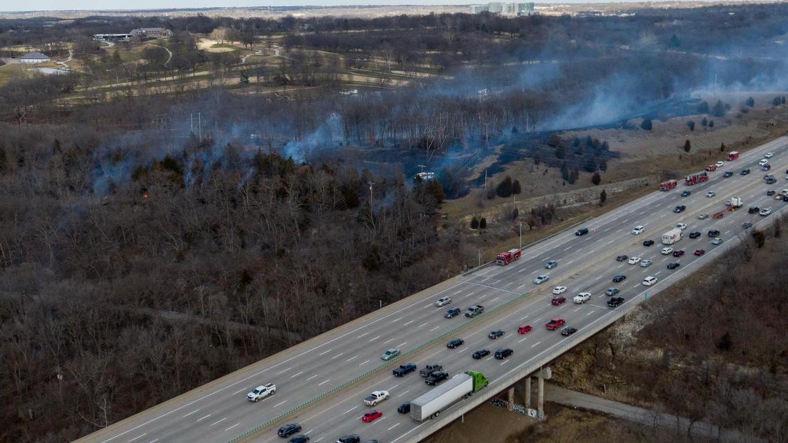 A large brush fire burns near Interstate 435 and Blue River Road on Friday, Feb. 23, 2024, in Kansas City.