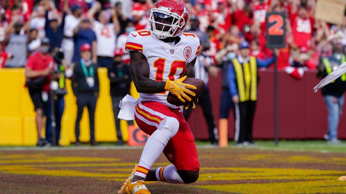 Kansas City Chiefs wide receiver Tyreek Hill (10) scores a touchdown against the Washington Football Team during the second half of an NFL football game, Sunday, Oct. 17, 2021, in Landover, Md. (AP Photo/Patrick Semansky)