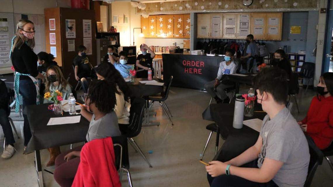 Zoe Walsh’s sixth-grade classroom was transformed into a cafe, where students read their poetry at an open-mic event. 